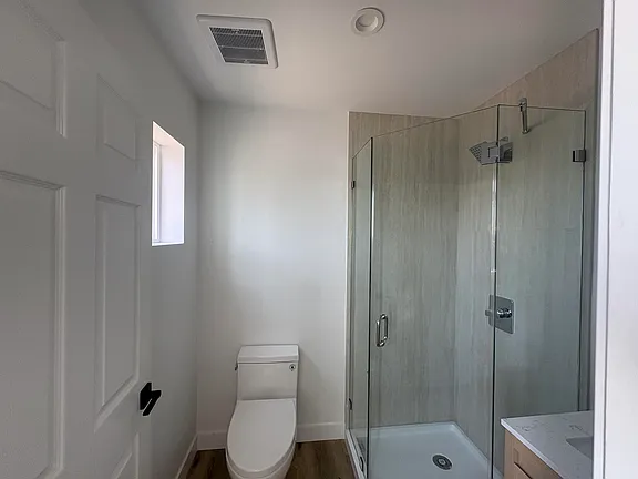 Bathroom with walk-in glass shower