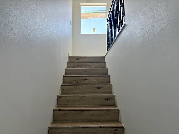 Stairs with wood treads and metal railing